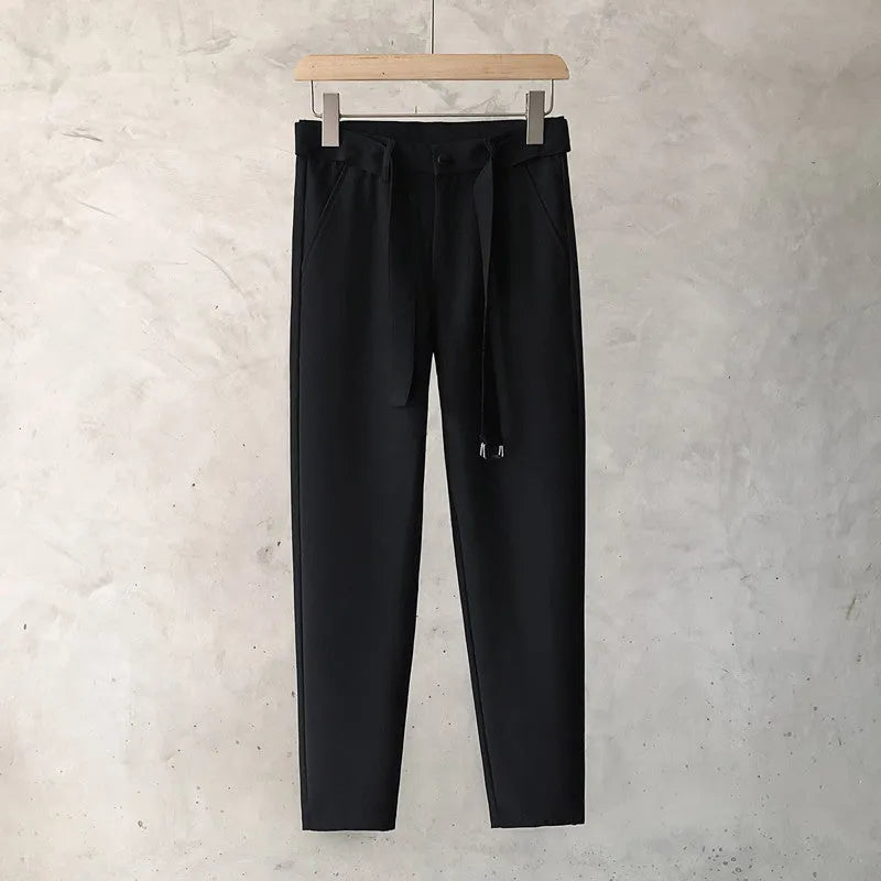 Boys slim straight wool trousers in a tapered fit, shown in a light grey colour.
