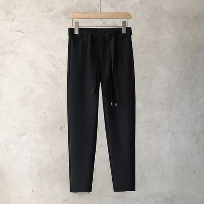Boys slim straight wool trousers in a tapered fit, shown in a light grey colour.