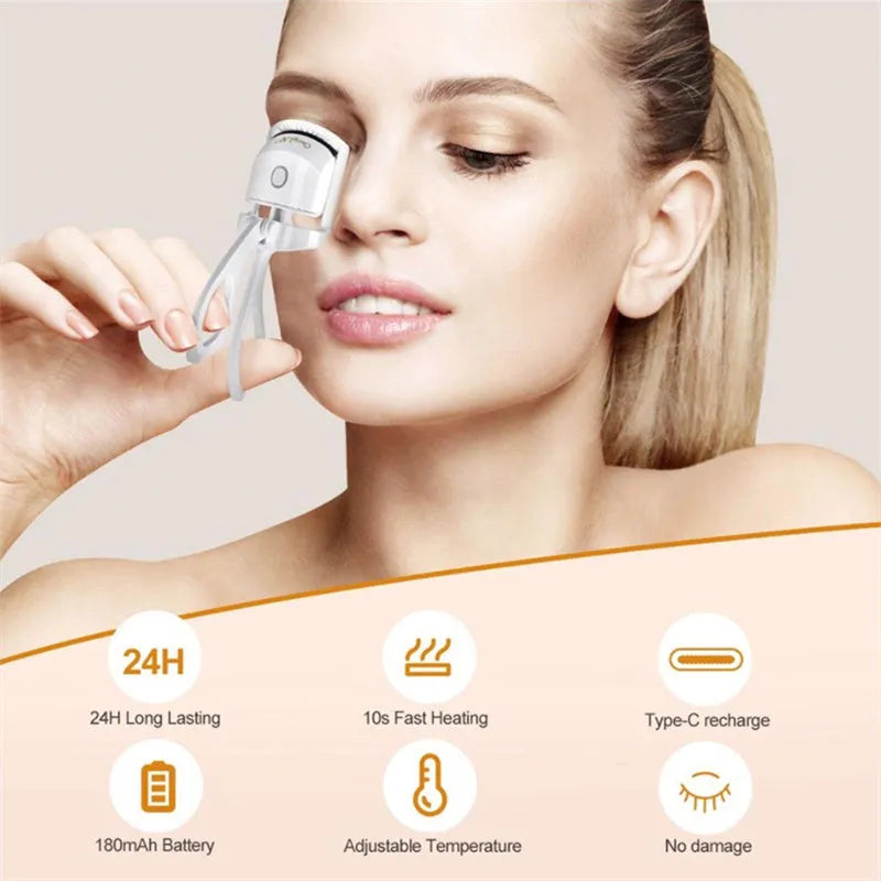 Pink heated electric eyelash curler with USB charging port and curved design with silicone pads