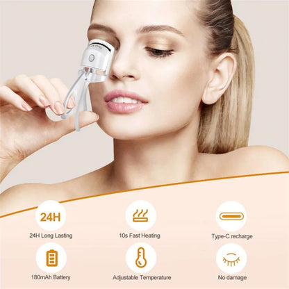 Pink heated electric eyelash curler with USB charging port and curved design with silicone pads