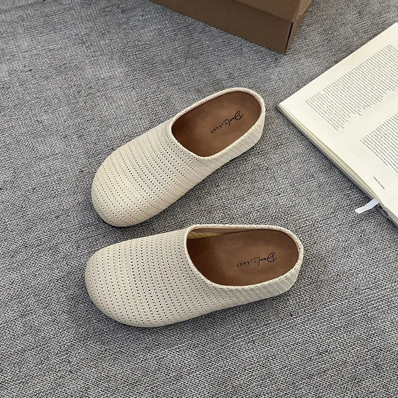 Women's non-slip cloth slippers with rubber sole in beige colour showing round toe design