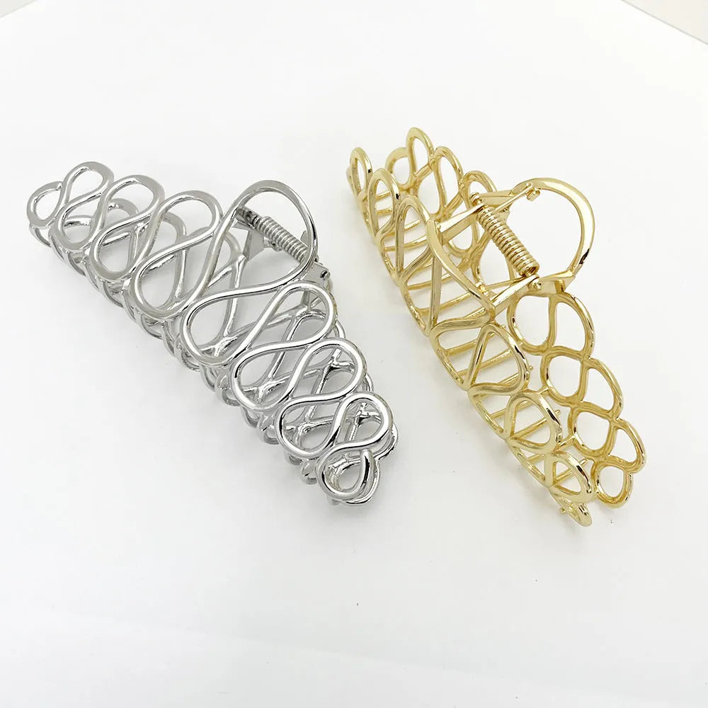 Large gold and silver minimalist hair clip with tassel detail for women's thick hair and updos.