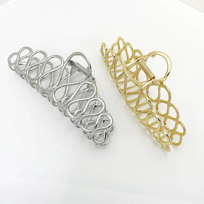 Large gold and silver minimalist hair clip with tassel detail for women's thick hair and updos.
