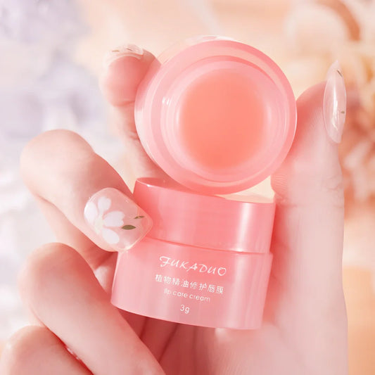 Jelly Lip Mask pot with application brush showing transparent gel texture