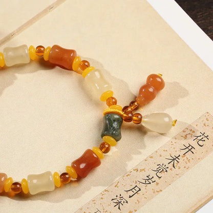 Natural Jinsi Jade small bone beads bracelet with geometric shape and Chinese auspicious patterns