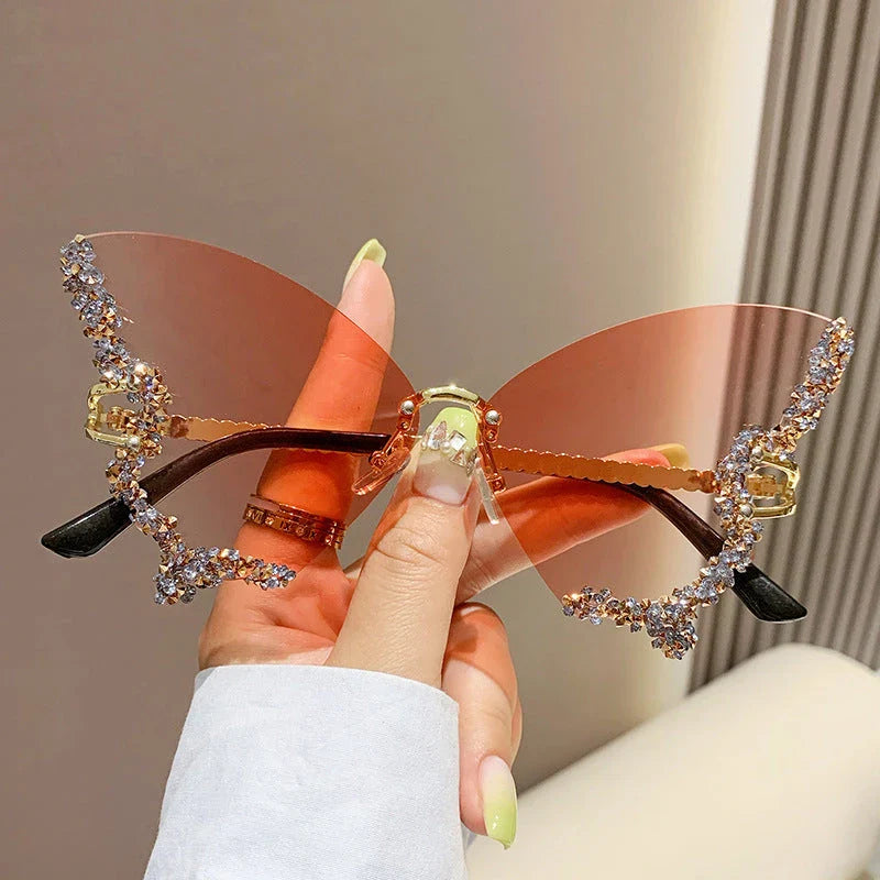 Luxurious diamond-studded butterfly sunglasses with oversized frames and a variety of color options