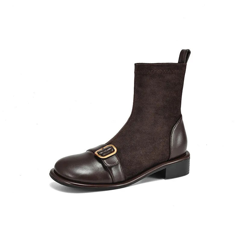 Women's black casual Martin boots with low heel, lace-up front, and decorative belt buckle stitching.