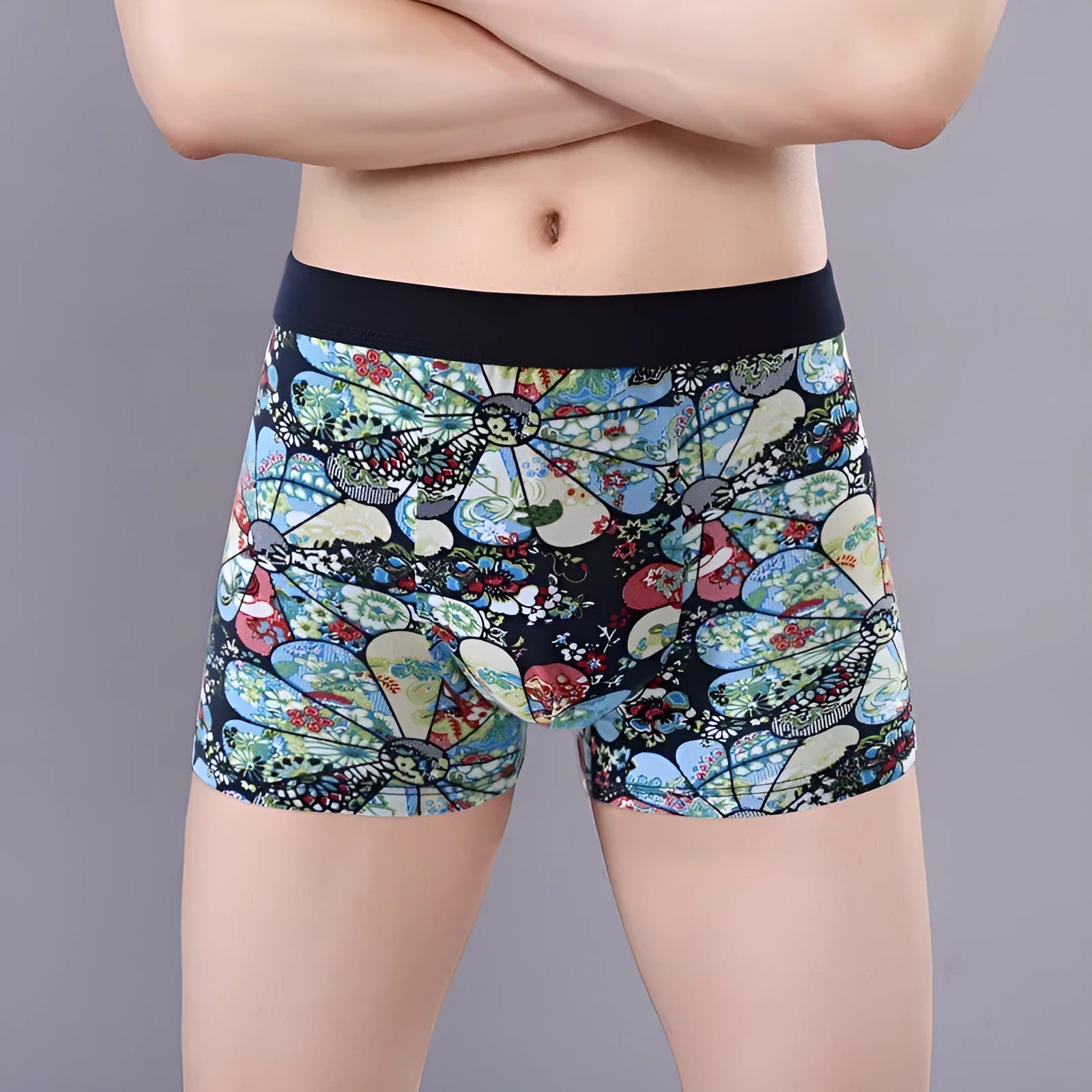 Men's cotton boxer briefs on a size chart showing weights for 3XL to 10XL, in floral colour options.
