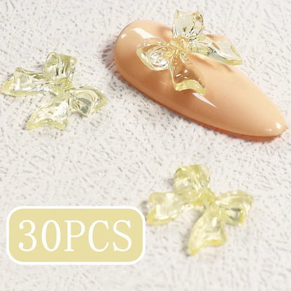 Candy pink bow-shaped 3D resin nail charms for adding a cute and playful touch to your manicure