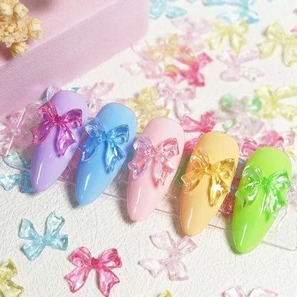 Candy pink bow-shaped 3D resin nail charms for adding a cute and playful touch to your manicure