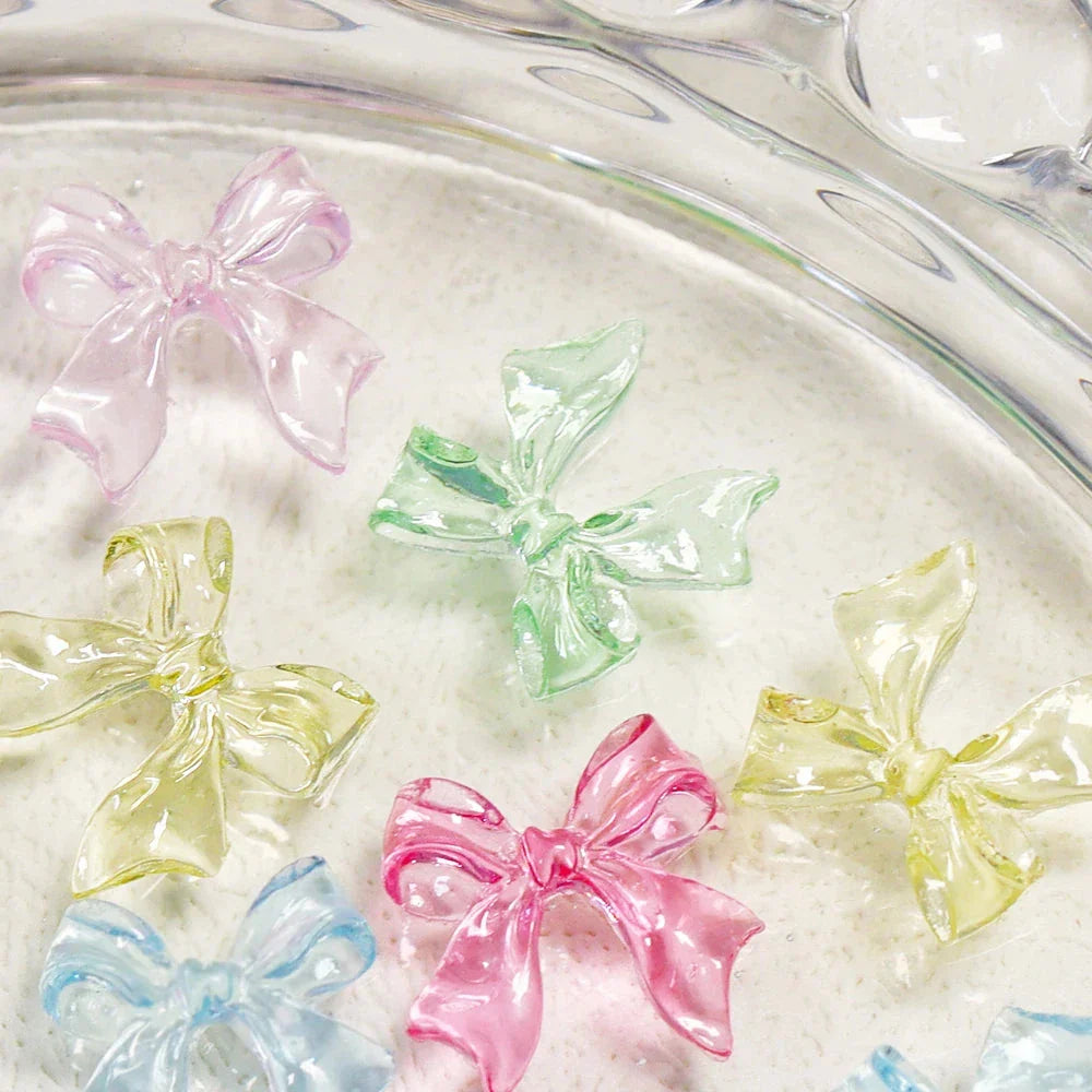 Candy pink bow-shaped 3D resin nail charms for adding a cute and playful touch to your manicure