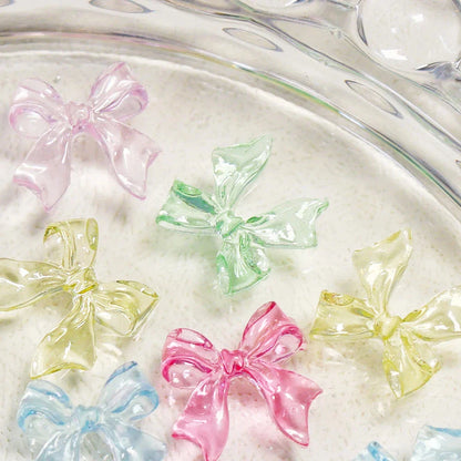 Candy pink bow-shaped 3D resin nail charms for adding a cute and playful touch to your manicure