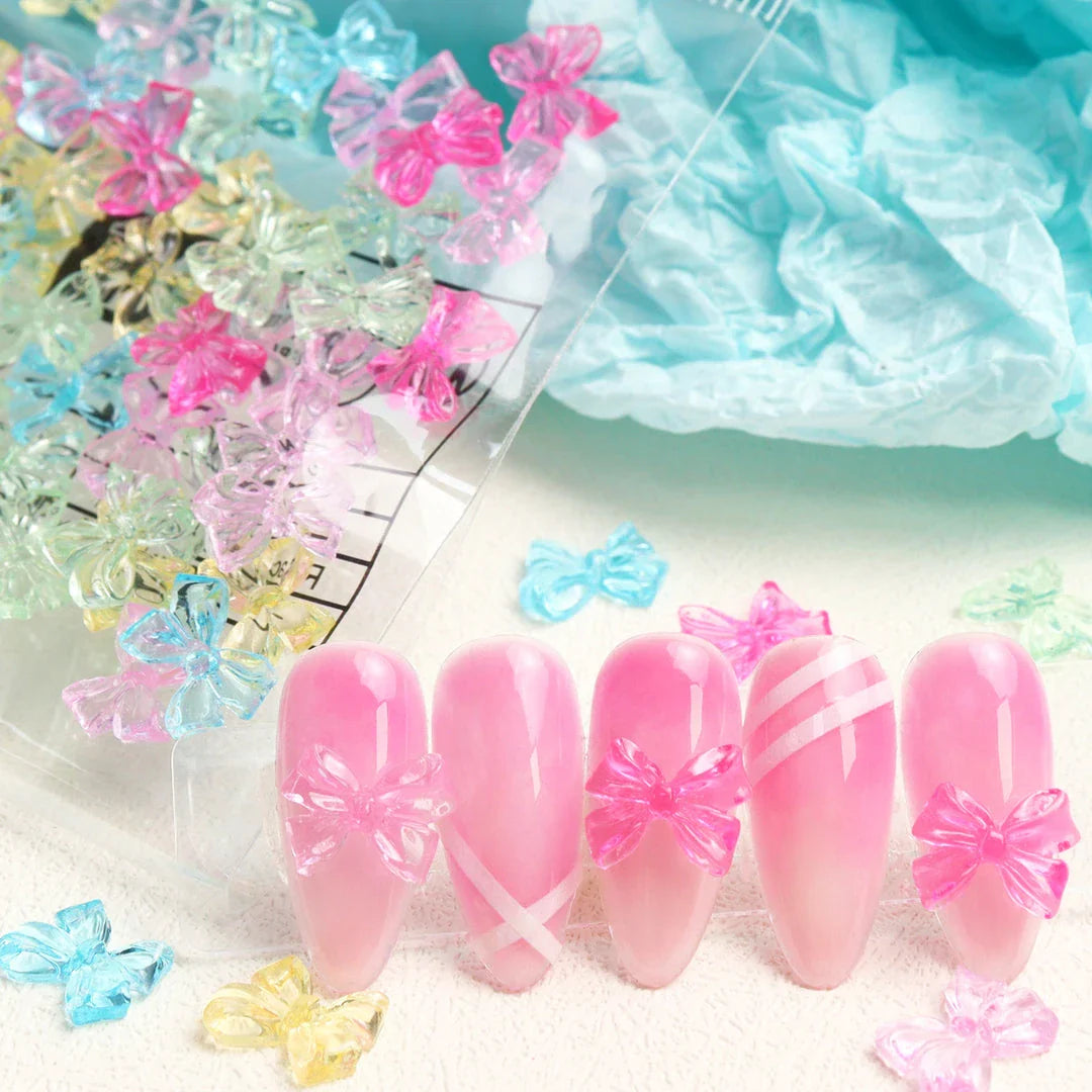 Candy pink bow-shaped 3D resin nail charms for adding a cute and playful touch to your manicure