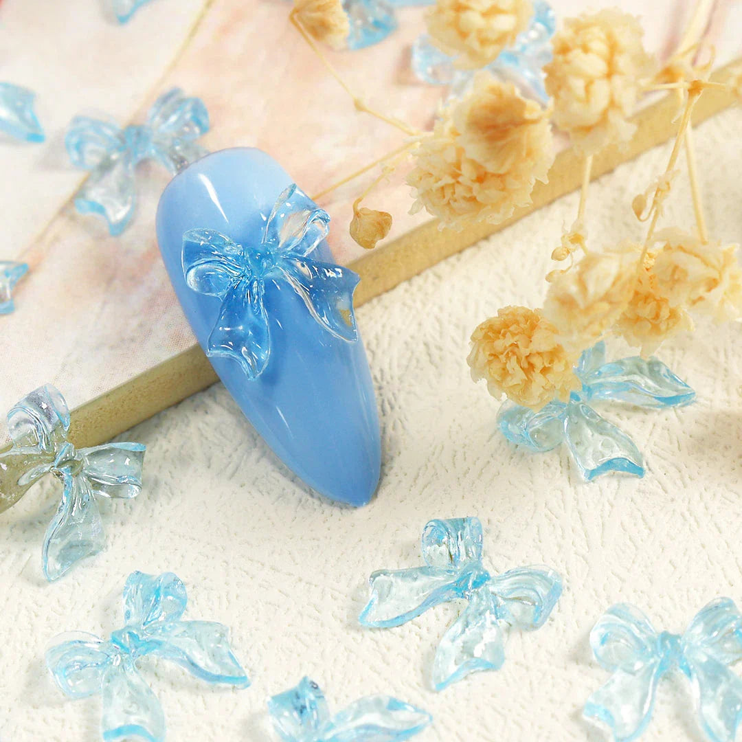 Candy pink bow-shaped 3D resin nail charms for adding a cute and playful touch to your manicure