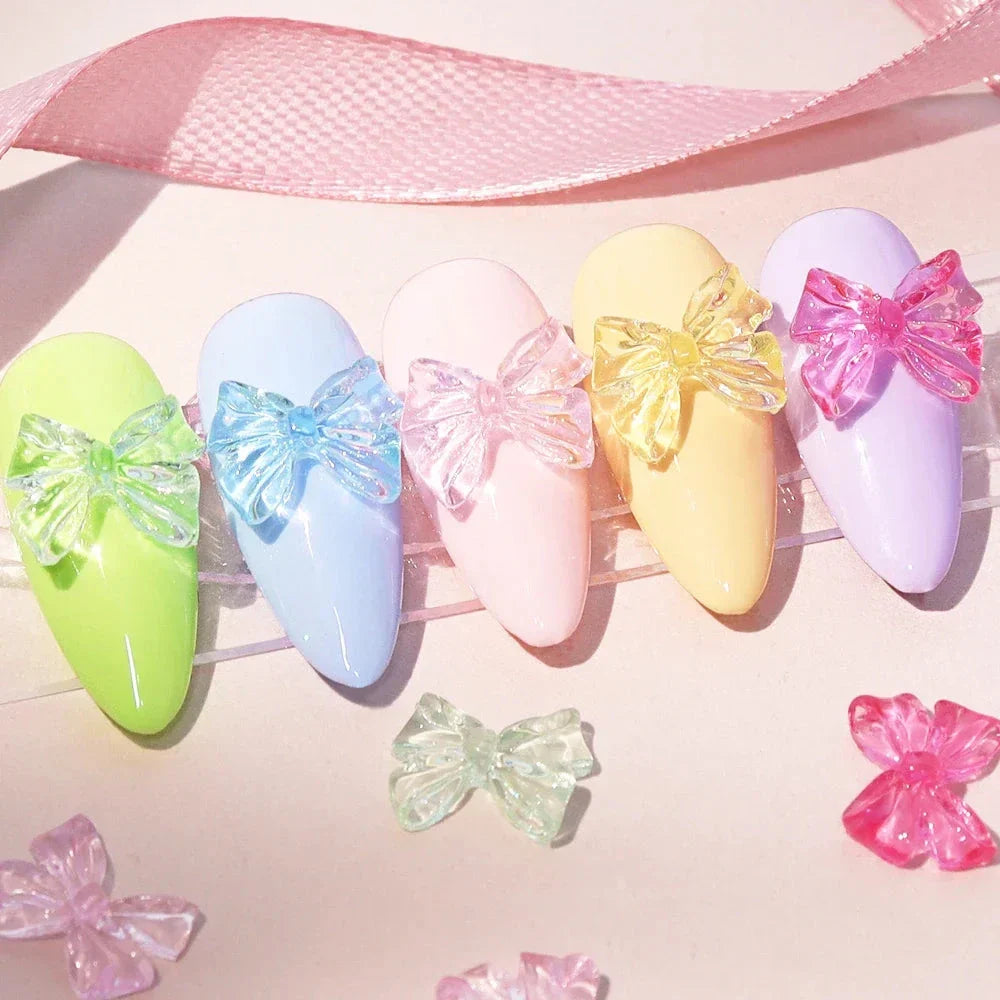 Candy pink bow-shaped 3D resin nail charms for adding a cute and playful touch to your manicure