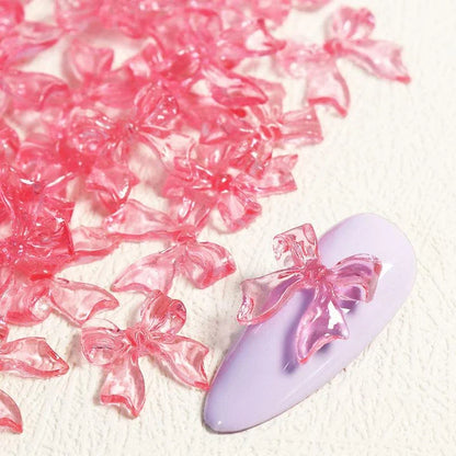 Candy pink bow-shaped 3D resin nail charms for adding a cute and playful touch to your manicure