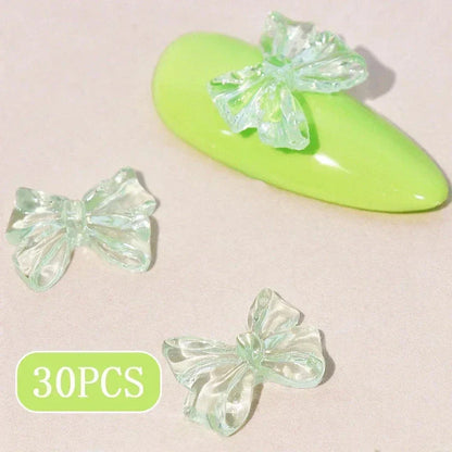 Candy pink bow-shaped 3D resin nail charms for adding a cute and playful touch to your manicure