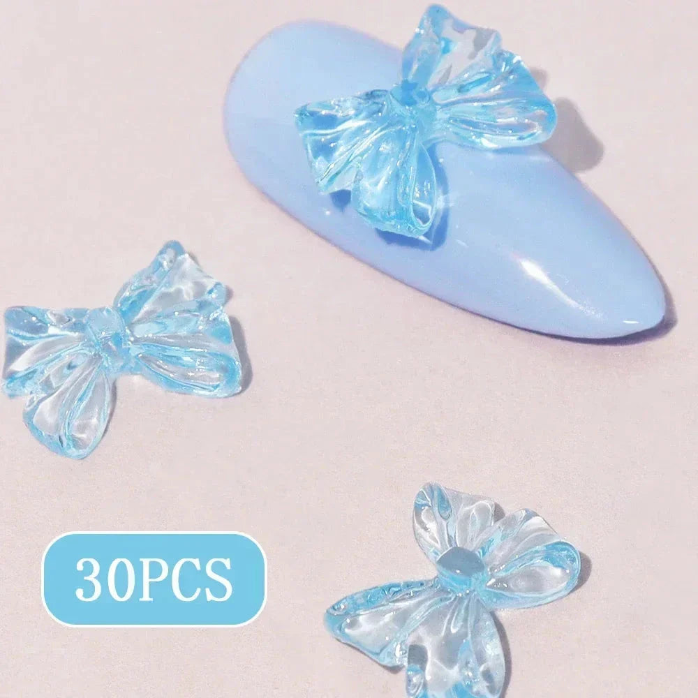 Candy pink bow-shaped 3D resin nail charms for adding a cute and playful touch to your manicure