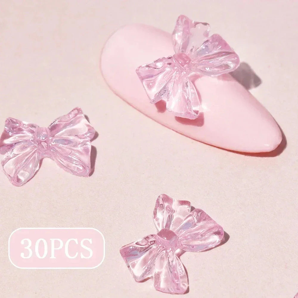 Candy pink bow-shaped 3D resin nail charms for adding a cute and playful touch to your manicure