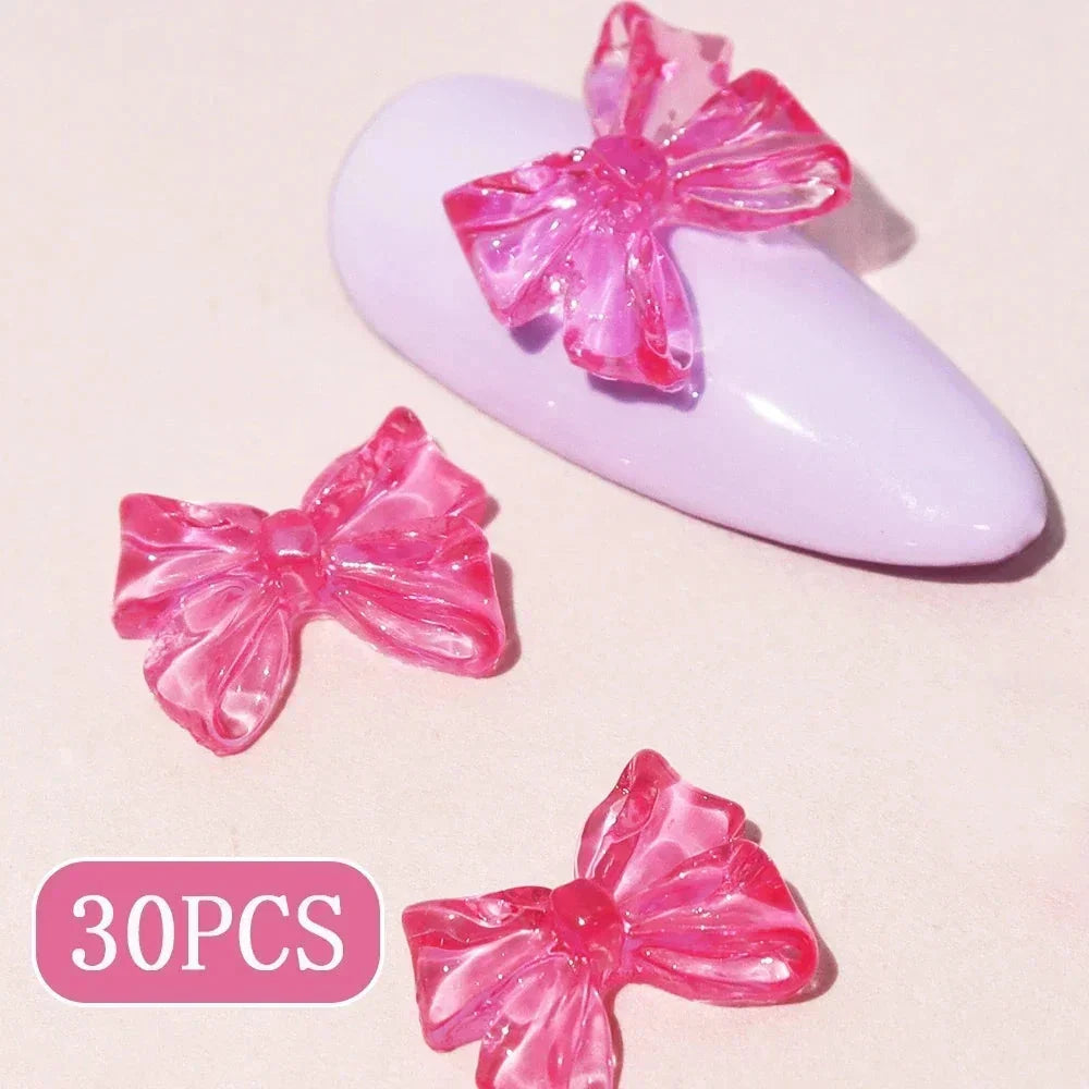 Candy pink bow-shaped 3D resin nail charms for adding a cute and playful touch to your manicure