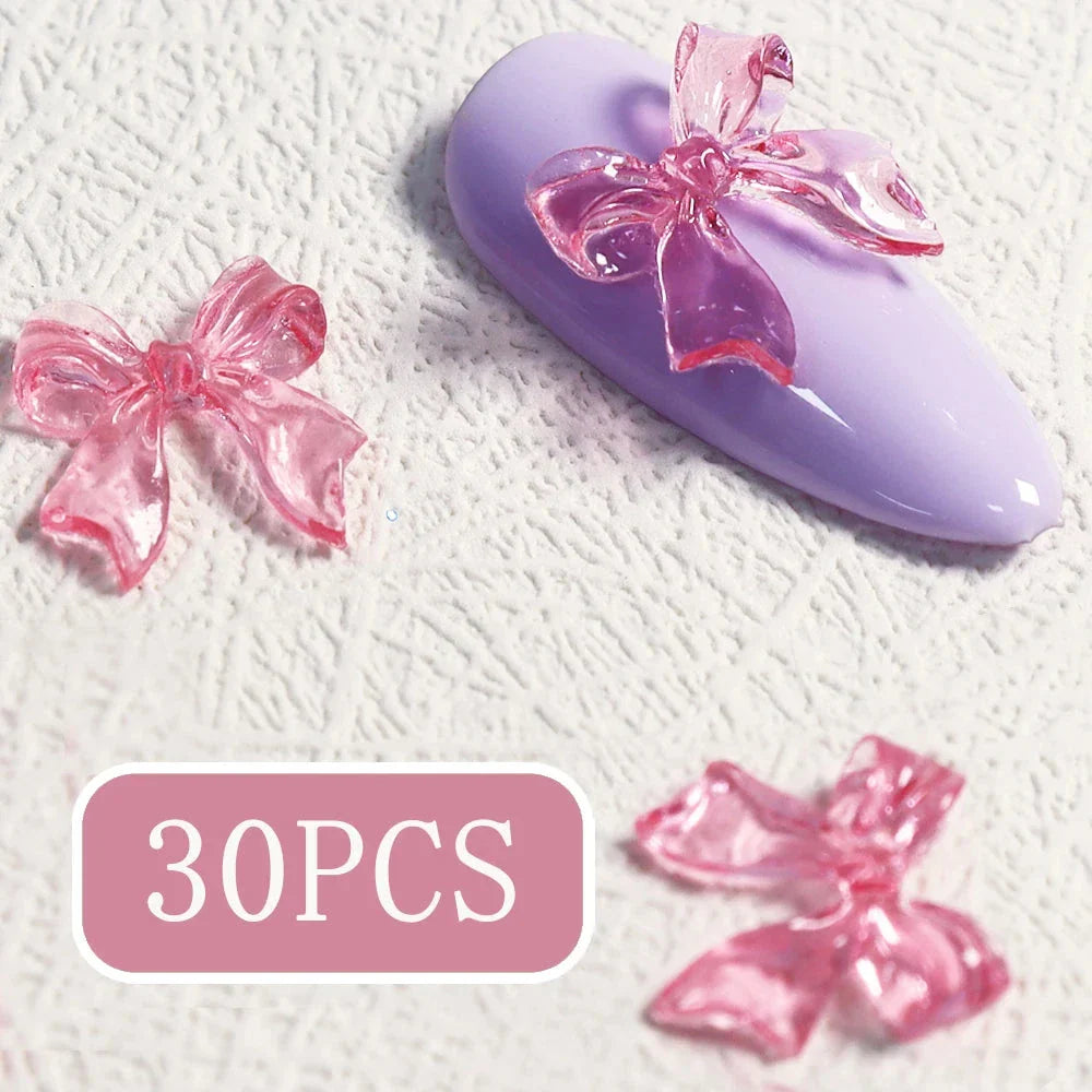 Candy pink bow-shaped 3D resin nail charms for adding a cute and playful touch to your manicure