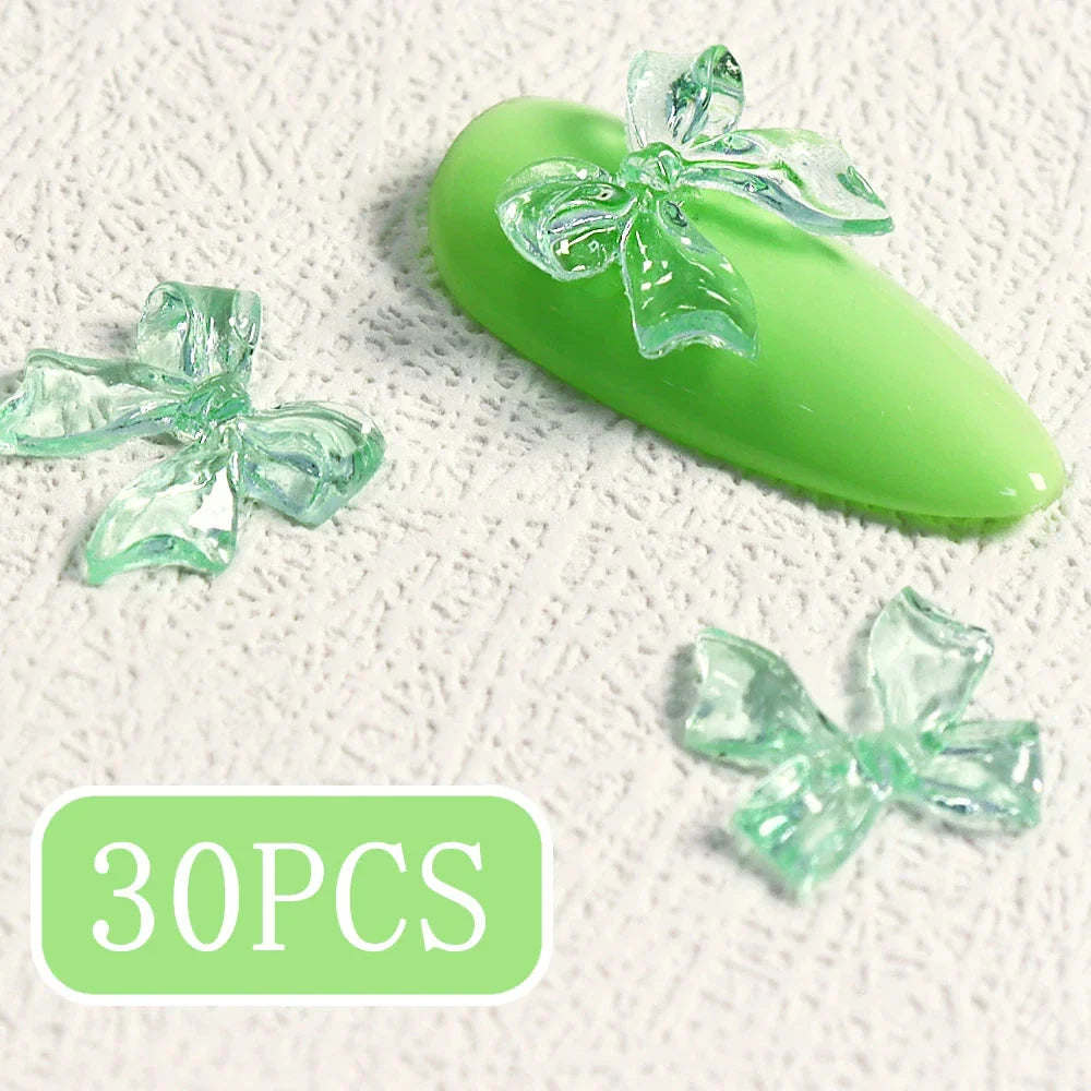 Candy pink bow-shaped 3D resin nail charms for adding a cute and playful touch to your manicure