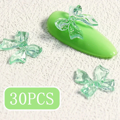 Candy pink bow-shaped 3D resin nail charms for adding a cute and playful touch to your manicure