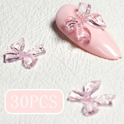 Candy pink bow-shaped 3D resin nail charms for adding a cute and playful touch to your manicure