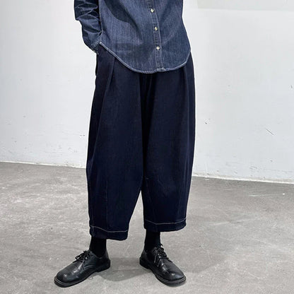 Women's cropped jeans in a denim blue color with a loose, relaxed fit for all-day comfort and style