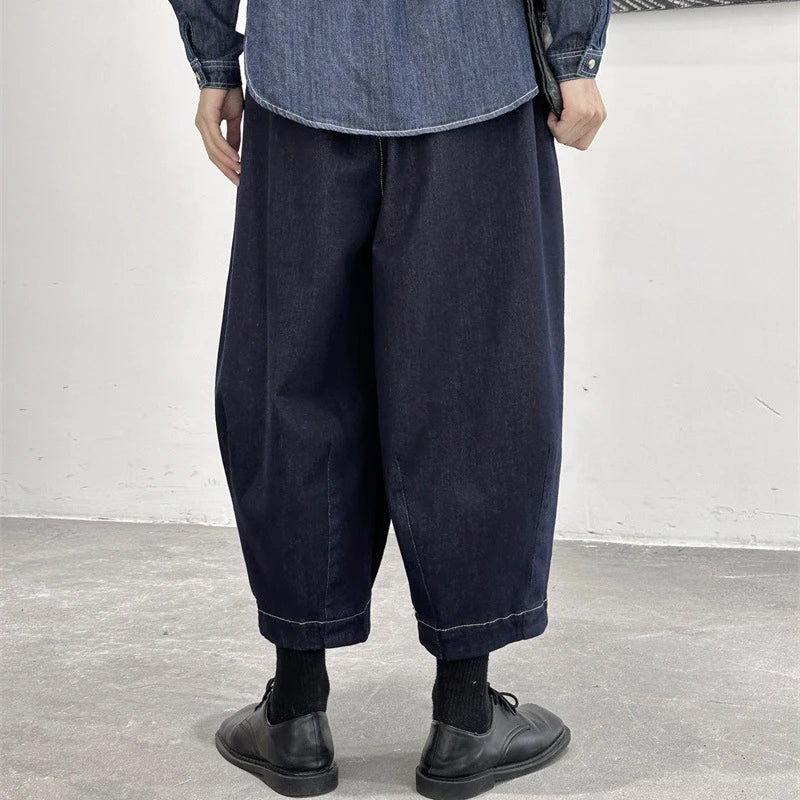 Women's cropped jeans in a denim blue color with a loose, relaxed fit for all-day comfort and style