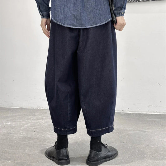 Women's cropped jeans in a denim blue color with a loose, relaxed fit for all-day comfort and style