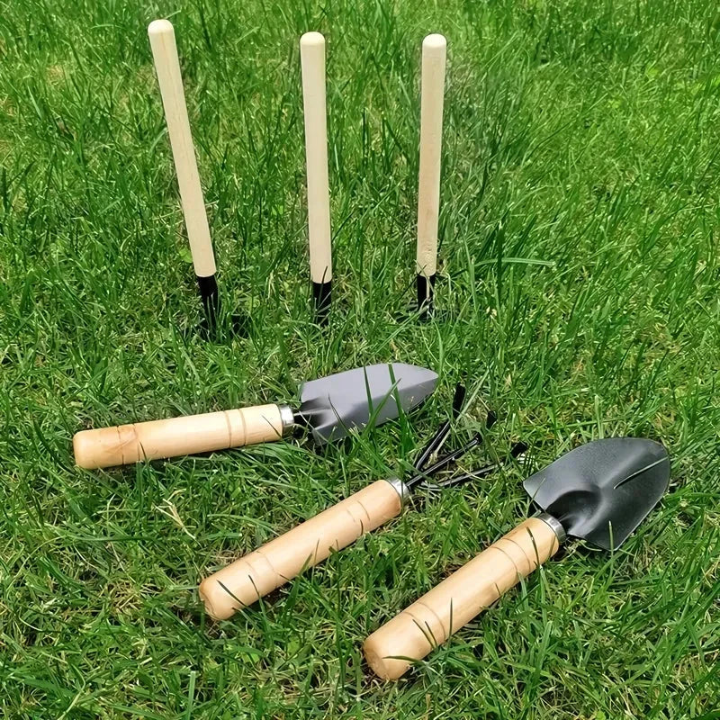 A set of 3 mini garden tools including a shovel, trowel, and rake made of premium solid wood and rust-proof iron for durable and efficient gardening