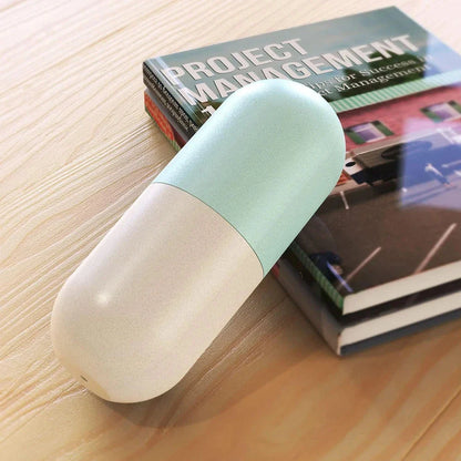 Portable weekly pill organizer with waterproof compartments, laser-engraved days, and secure spin-locking system