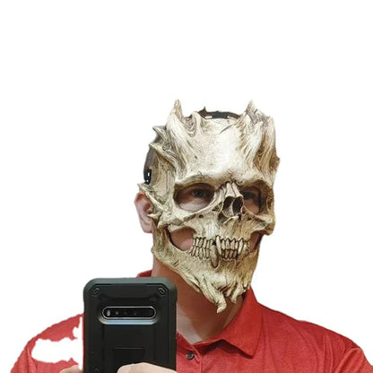 A white and red skull-shaped latex Halloween mask with a chilling, horror-inspired design