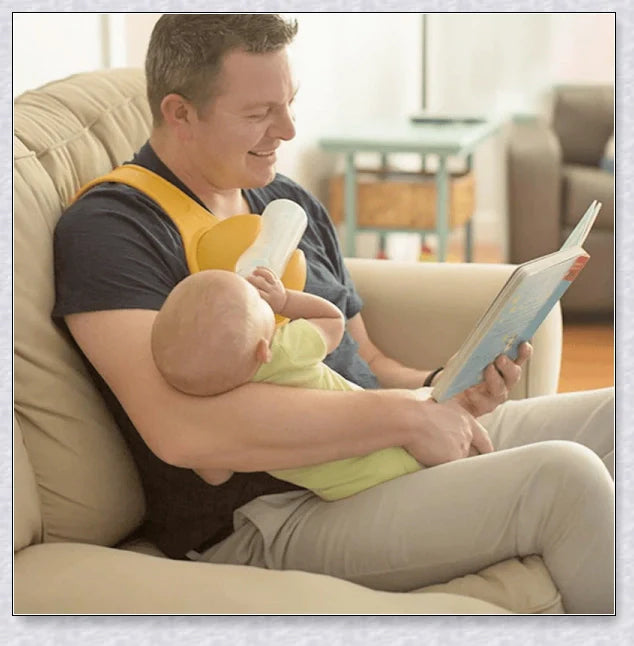 A yellow hands-free baby bottle holder that allows parents to multitask during feeding time