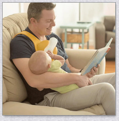 A yellow hands-free baby bottle holder that allows parents to multitask during feeding time