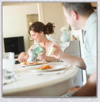 A yellow hands-free baby bottle holder that allows parents to multitask during feeding time