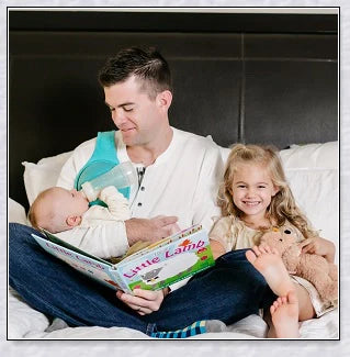 A yellow hands-free baby bottle holder that allows parents to multitask during feeding time