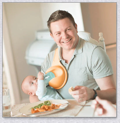 A yellow hands-free baby bottle holder that allows parents to multitask during feeding time