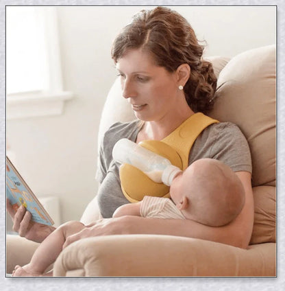 A yellow hands-free baby bottle holder that allows parents to multitask during feeding time
