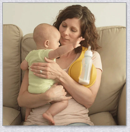 A yellow hands-free baby bottle holder that allows parents to multitask during feeding time