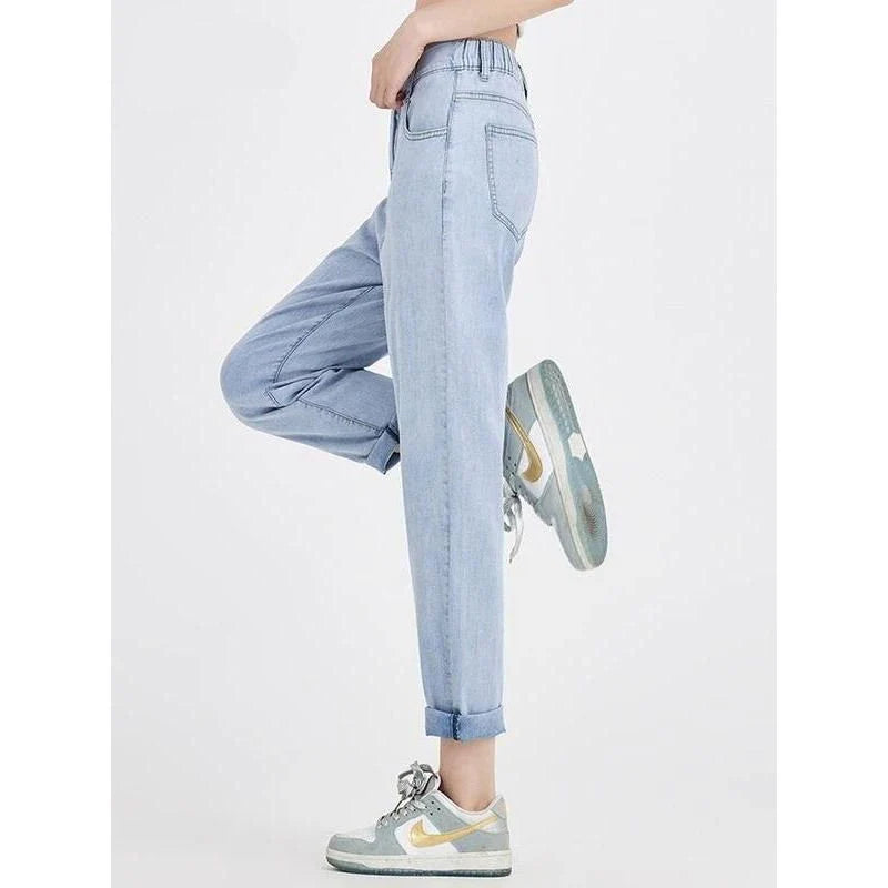 Light blue casual high waist harem jeans with a flattering fit and trendy style