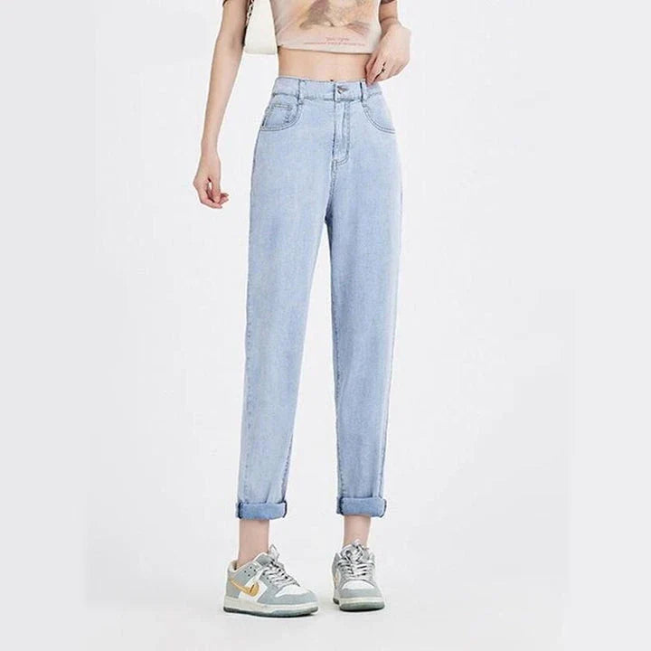 Light blue casual high waist harem jeans with a flattering fit and trendy style