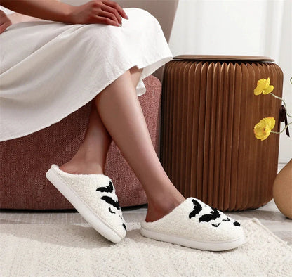 Halloween bat design plush slippers for indoor wear, available in white and black