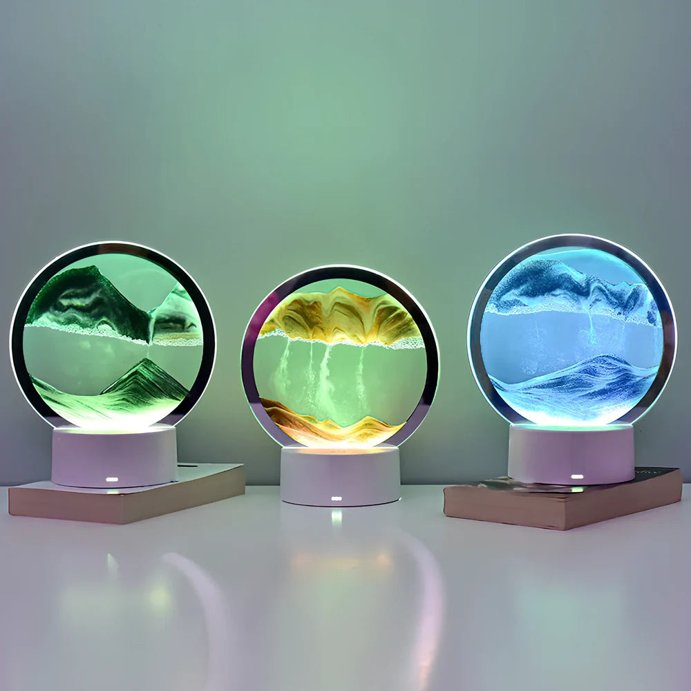 Desktop hourglass lamp with colourful LED lighting illuminating flowing quicksand patterns