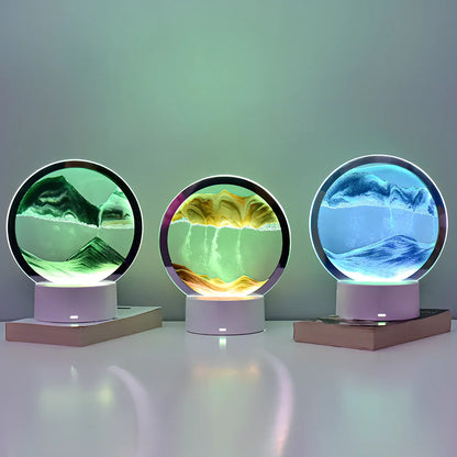 Desktop hourglass lamp with colourful LED lighting illuminating flowing quicksand patterns