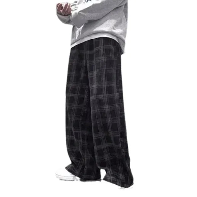 Men's black and green plaid straight leg trousers showing mid-waist design and six size options