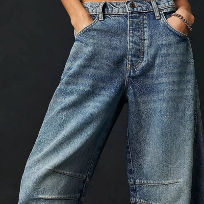 Women's mid-rise barrel jeans with wide leg design in various colors