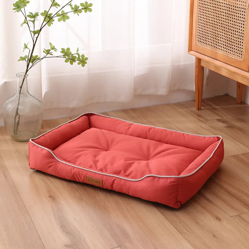 Grey waterproof Oxford cloth dog sofa bed on a wooden floor