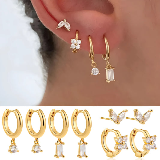 A set of geometric and star-shaped copper earrings with zircon accents in gold or silver plating.